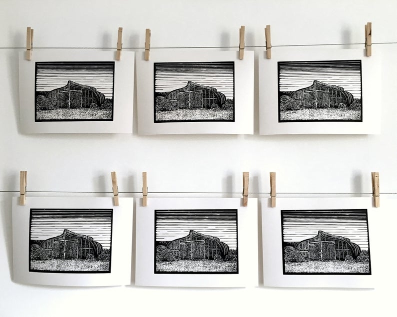 Lindisfarne boat shed linocut print hanging